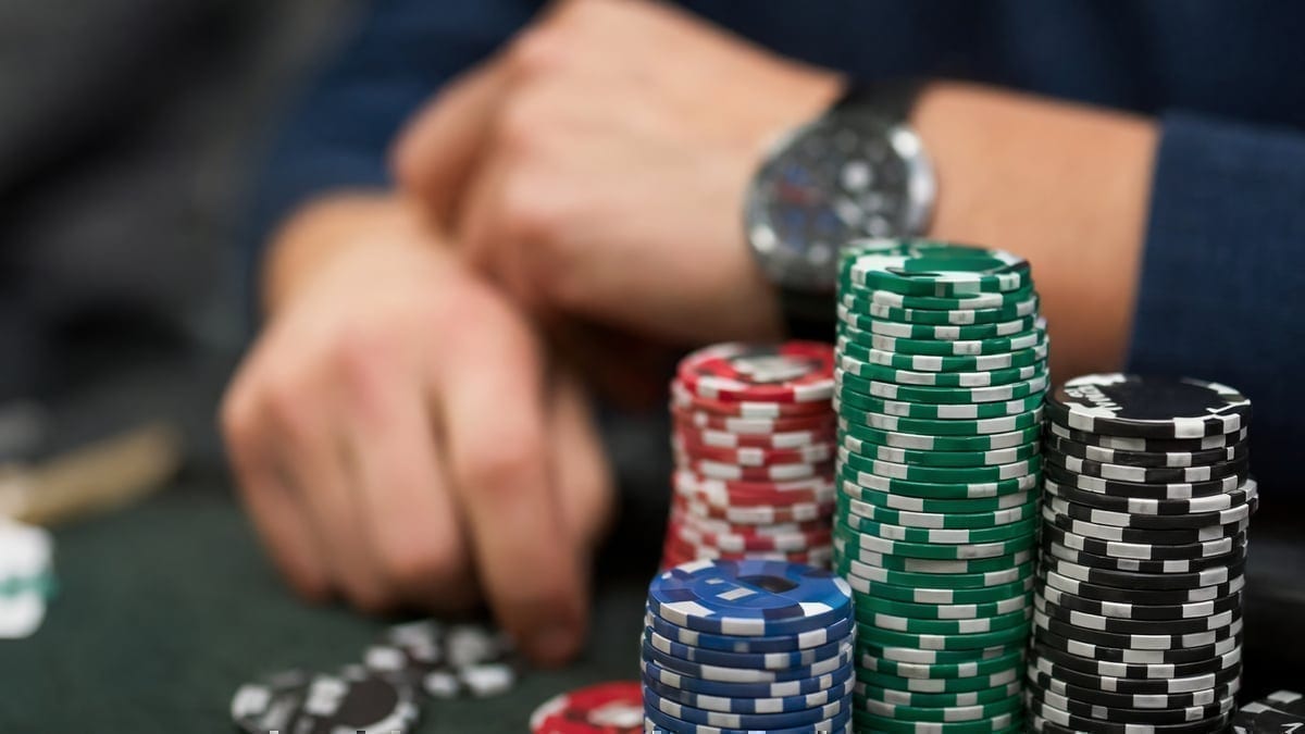 Poker tournament backing and chip negotiations