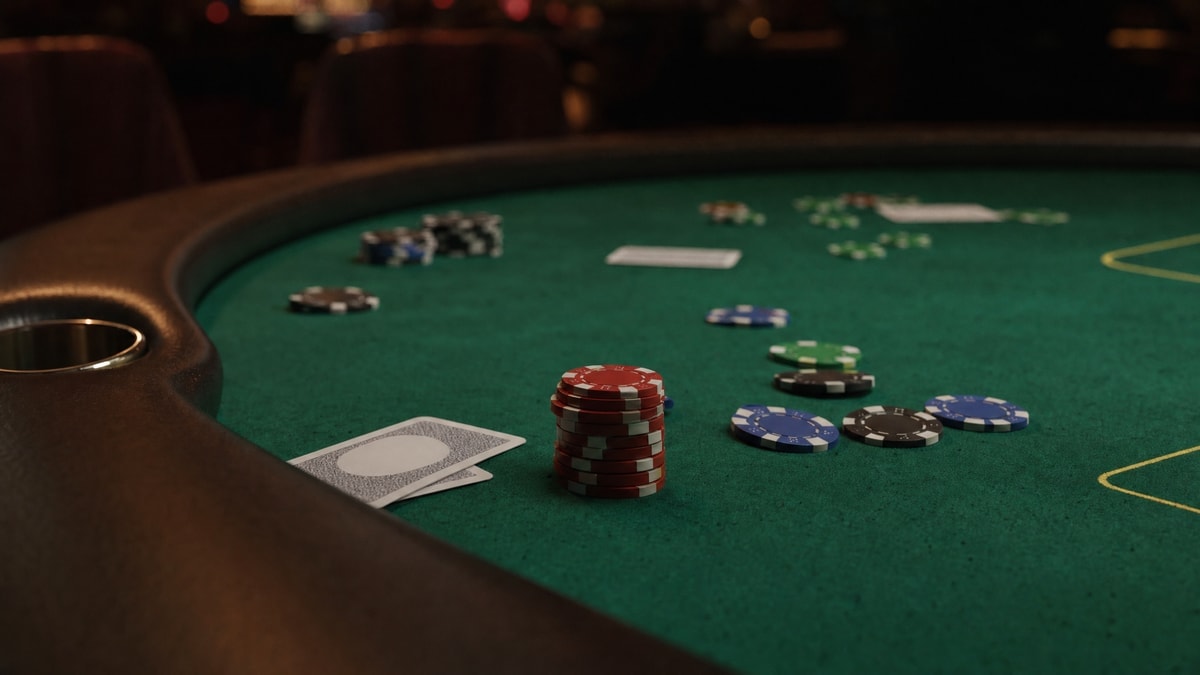 Empty poker table under casino lighting representing a paused career