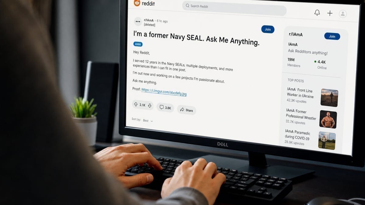 Hands typing responses during Reddit AMA session