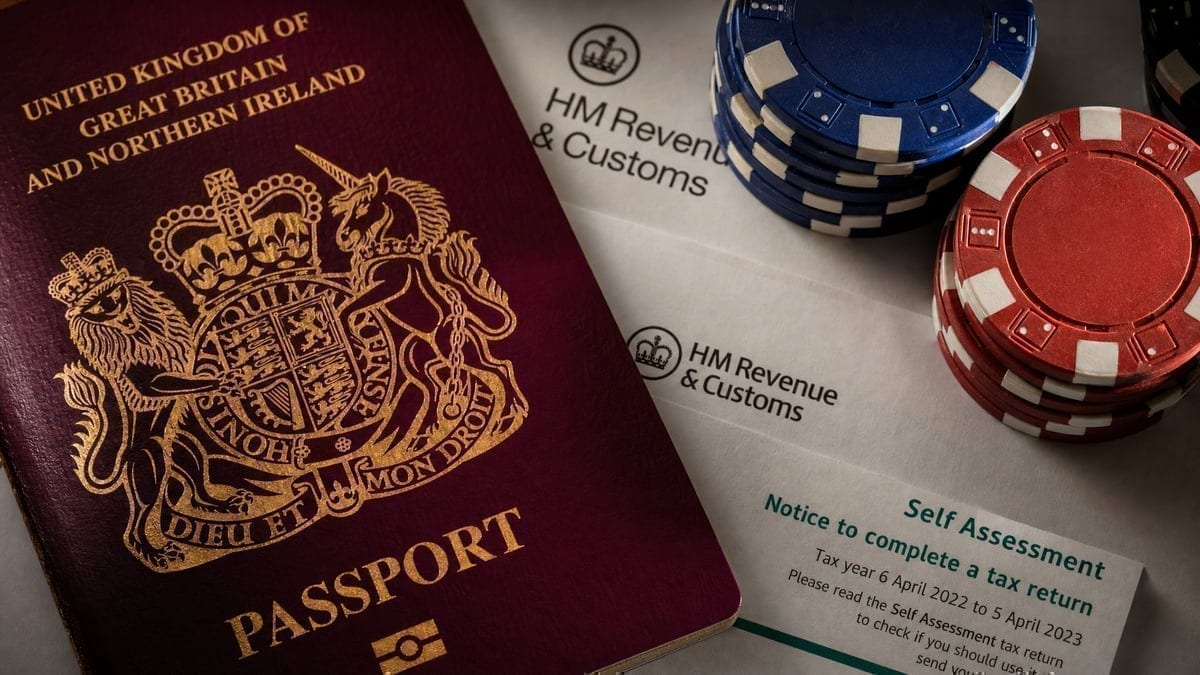 British passport alongside poker chips and tax paperwork